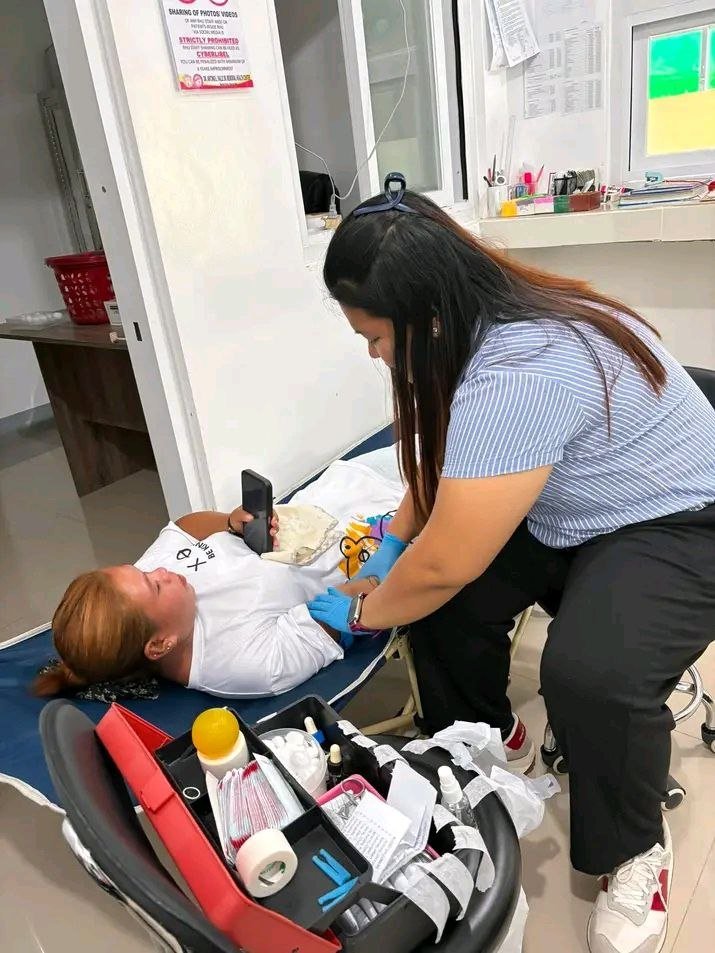 Staff attending to a patient